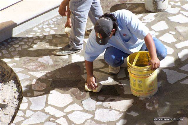 loreto-bay-baja-founders-pool-construction-update-3 And then sponge away the cement that’s over the stones.