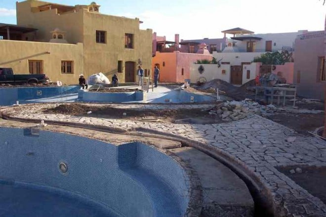 loreto-bay-swimming-pool-12-29-08-3 Nice flagstone is being laid around the swimming pool. I did get confirmation that the tree we saw earlier was removed for now as it was planted too early in the construction process. I assume it will be replanted as this pool gets closer to completion.