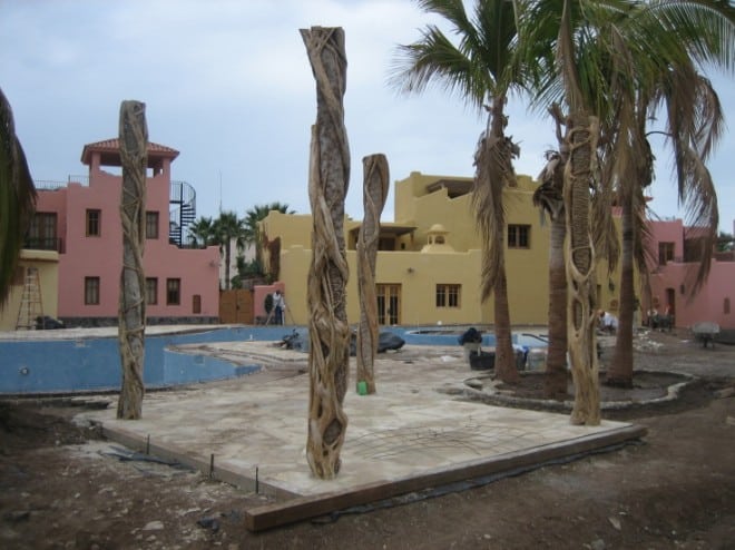 poolbar The pool bar. The posts look quite interesting with the twisted trunks. I wonder what the rest of the structure will look like.