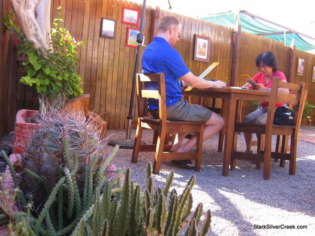 Trying out lattes and cappuccinos along with cinnamon rolls at El Cafe de Lolita. Photos by Deborah Scanlon adorn the cafe.