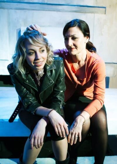 Daughter (Monique Hafen) and Harper (Susi Damilano) bond.