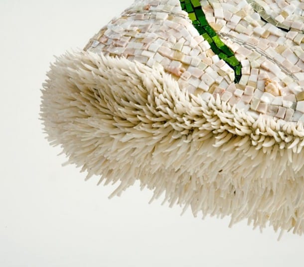 Dentalia, or sea spines coat the entire underside of the dress Dentalia, or sea spines coat the entire underside of the dress