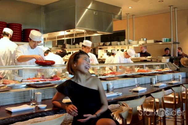 Front row seat: Watching the sushi chefs perform, and laughing indiscriminately. Front row seat: Watching the sushi chefs perform, and laughing indiscriminately.
