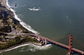 WhiteKnightTwo flies over the Golden Gate Bridge enroute to SFO Terminal 2.