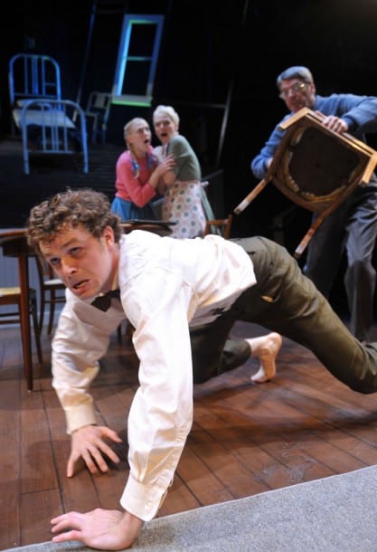 Gregor (front, Alexander Crowther) runs from his father (r. Allen McKelvey*) as his sister Grete and mother (c. l-r, Megan Trout, Madeline H.D. Brown) look on Gregor (front, Alexander Crowther) runs from his father (r. Allen McKelvey*) as his sister Grete and mother (c. l-r, Megan Trout, Madeline H.D. Brown) look on