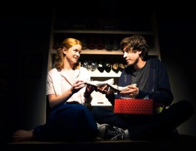 Sherri (Melissa Quine) and Zack (Jeremy Kahn) share truths in his mothers shoe closet.
