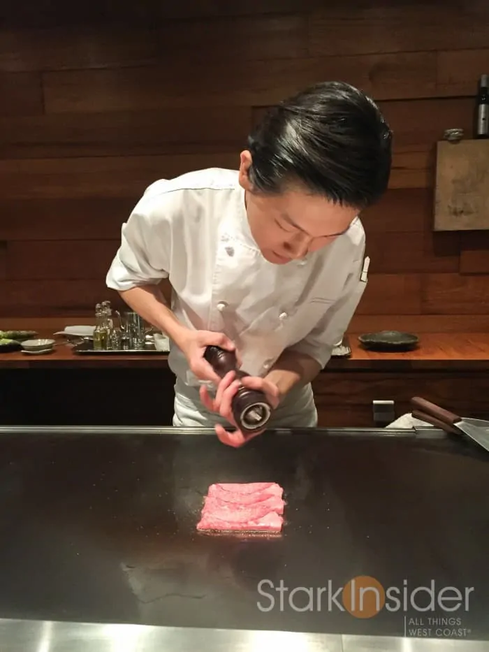 Chef Jason applies a light seasoning to the Wagyu beef rolls. The heat with the marbling of fat provide the perfect base for the seasoning.