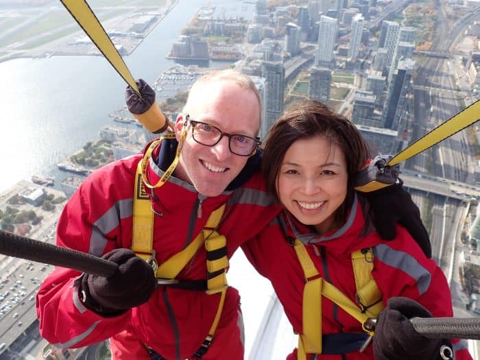 Clinton and Loni Stark walking CN Tower rim 2016