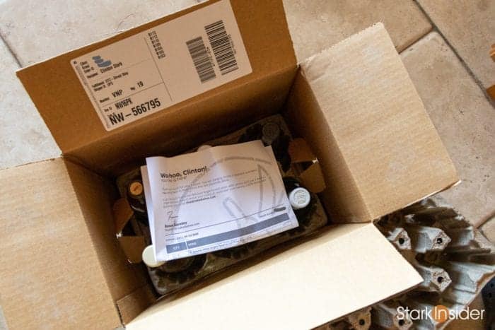 Naked Wines wine delivery box with bottles and tasting notes