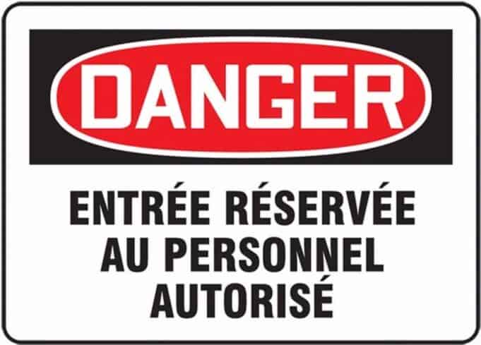 French danger sign reading “Entrée Réservée au Personnel Autorisé.”