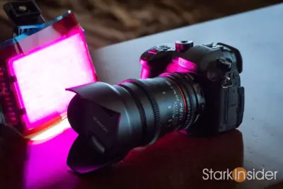A Panasonic GH5 camera in front of purple LED lighting.