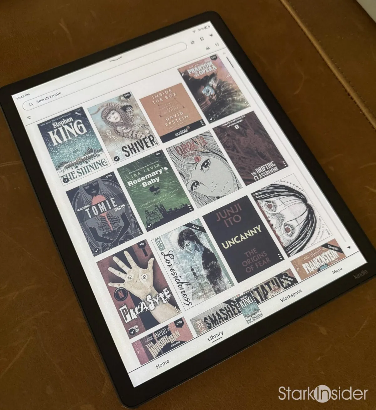 Kindle Scribe Colorsoft library grid showing colour book covers including The Shining, Shiver, Tomie and Phantom of the Opera