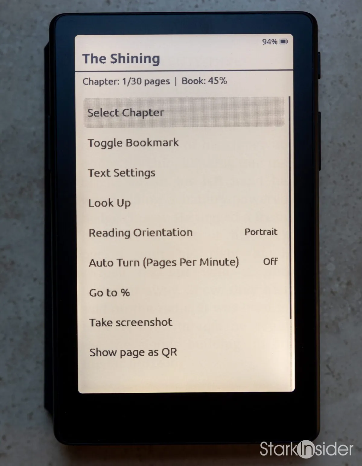 XTEINK X4 Pro settings menu for The Shining showing options for Select Chapter, Toggle Bookmark, Text Settings, Look Up, Reading Orientation, and Auto Turn