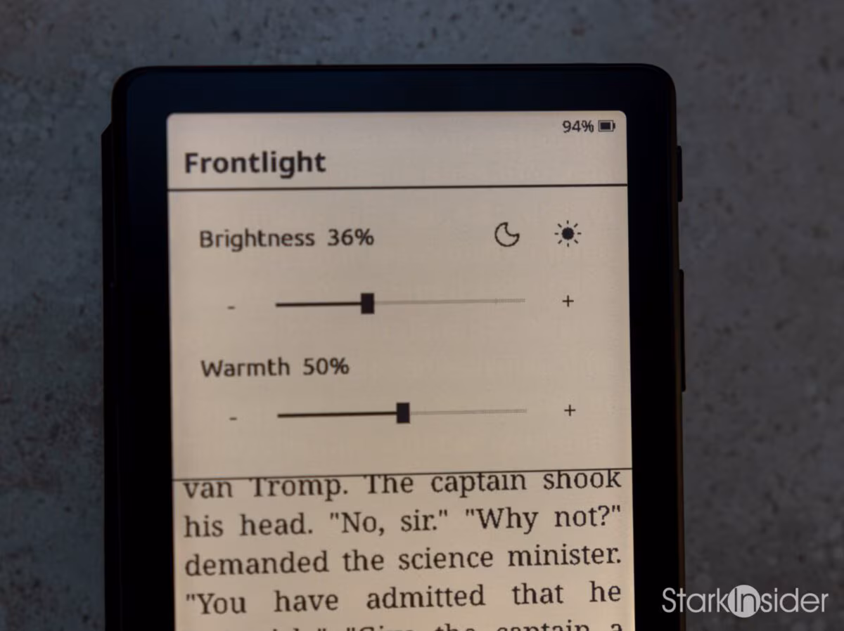 XTEINK X4 Pro front light settings screen showing brightness at 36 percent and warmth at 50 percent, with book text visible behind the menu